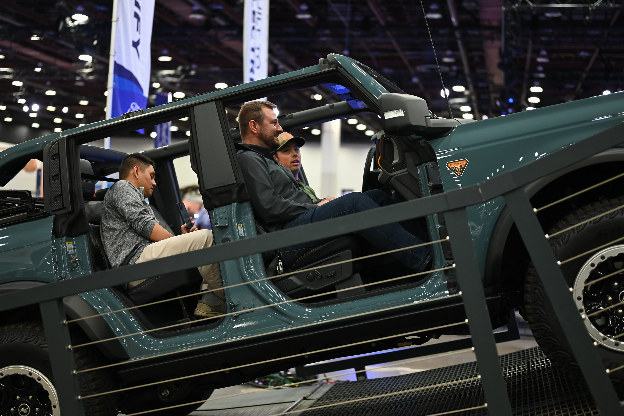 Attendees test driving a car at the Detroit Auto Show