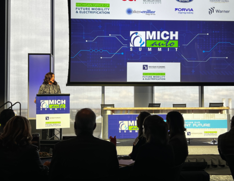 Gov. Whitmer on stage at the 2022 MICHauto Summit announcing a $2M grant for the program.