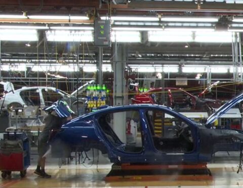 cars being assembled in an auto plant