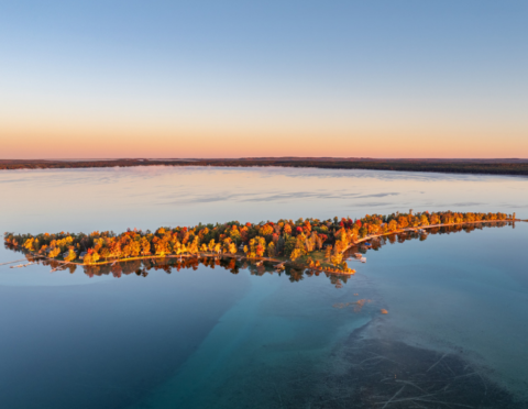 Treasure Island, Higgins Lake, Michigan. Captured the morning light lingt on a calm autumn morning.