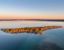 Treasure Island, Higgins Lake, Michigan. Captured the morning light lingt on a calm autumn morning.
